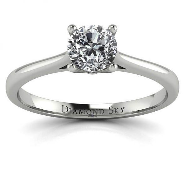 Stylowa klasyka - Pierścionek zaręczynowy z z platyny z diamentem i szafirem