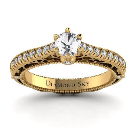 Dostojna elegancja - Pierścionek zaręczynowy z żółtego złota z białym szafirem i diamentami